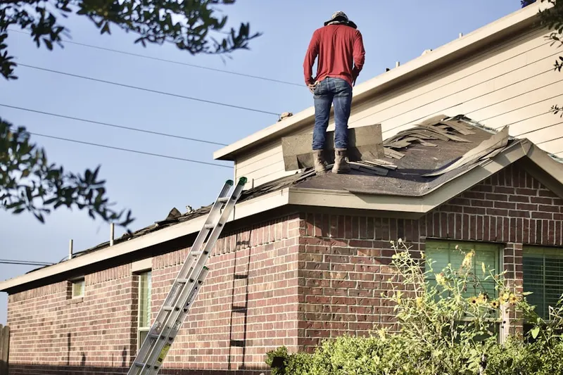 Professional roofer working on a residential roof in Oneco